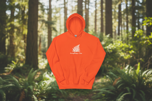 Everything's Fine Orange Hoodie with forest background